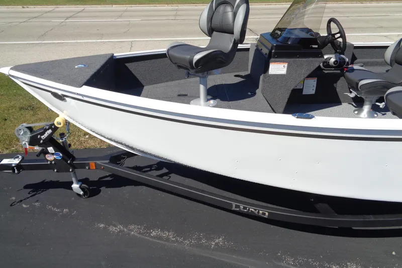 Slide: The Image of 2026 Lund 1650 Rebel XL SS boat on trailer, featuring sleek design and comfortable seating. - 3