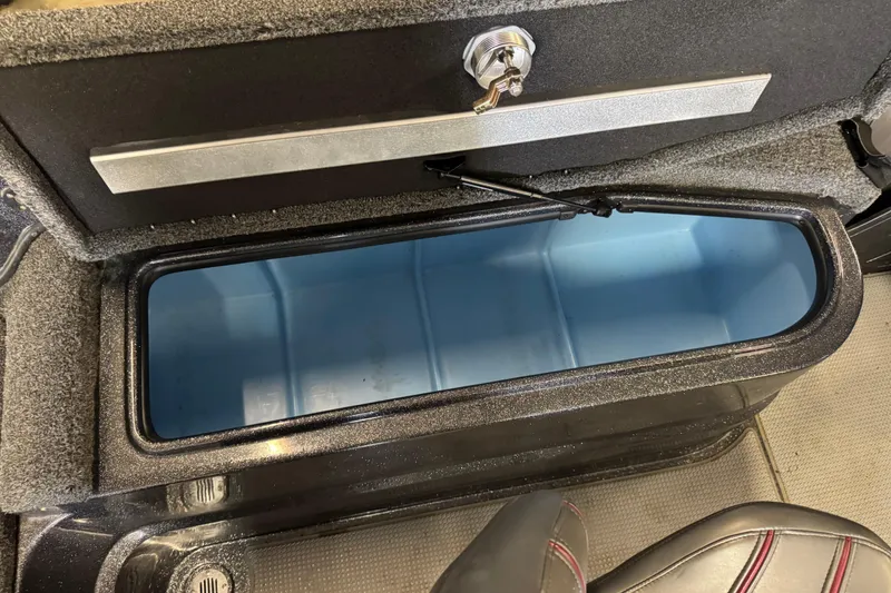 Slide: The Image of Open storage compartment in 2022 Nitro ZV21 Pro boat, featuring a secure latch and spacious interior. - 13