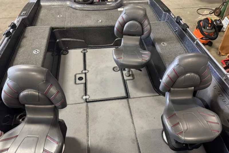 Slide: The Image of Interior of a 2022 Nitro ZV21 Pro boat with four gray seats. - 19