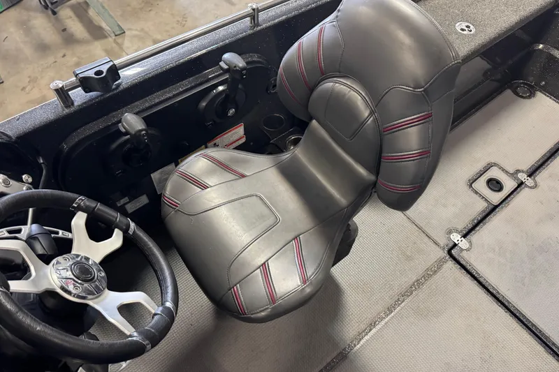 Slide: The Image of 2022 Nitro ZV21 Pro boat interior with steering wheel and cushioned seat. - 7