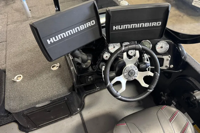 Slide: The Image of Nitro ZV21 Pro 2022 boat dashboard with dual Humminbird displays and steering wheel. - 8