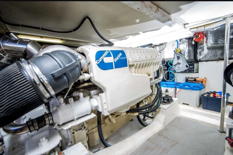 Slide: The Image of Engine room of 2000 Riviera 48 Enclosed Flybridge with Cummins Marine engine. - 23