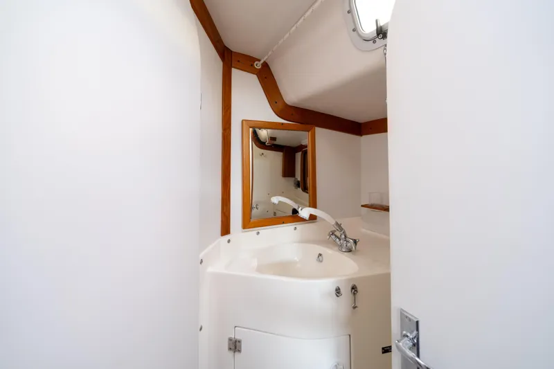 Slide: The Image of Bathroom interior of 2000 J Boats J/120 yacht with sink and mirror. - 17