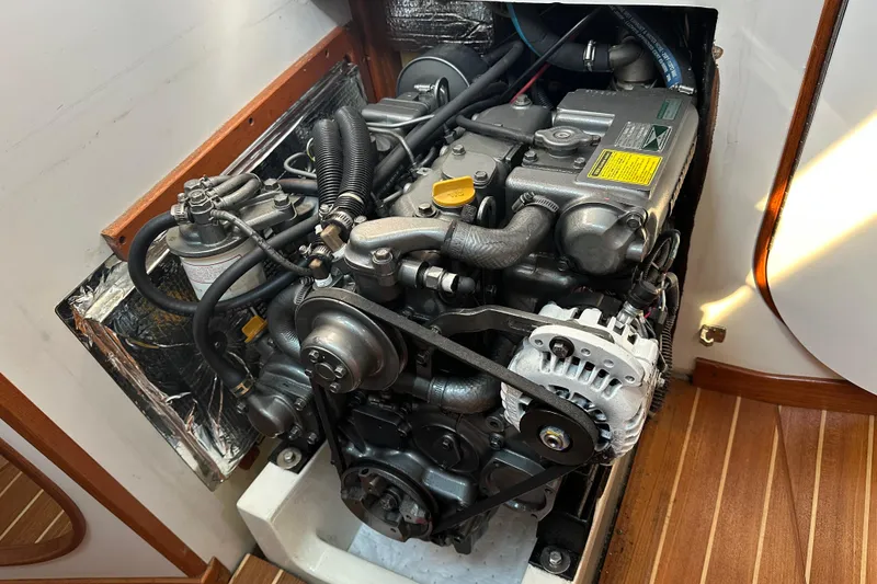 Slide: The Image of Engine of a 2000 J Boats J/120 sailboat, showcasing detailed mechanical components. - 20