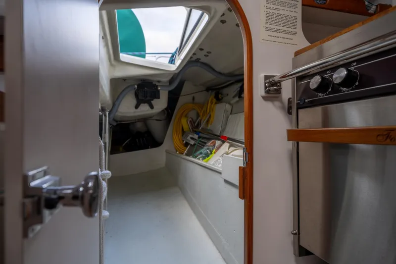 Slide: The Image of Interior view of a 2000 J Boats J/120 sailboat, featuring a compact cabin space. - 27