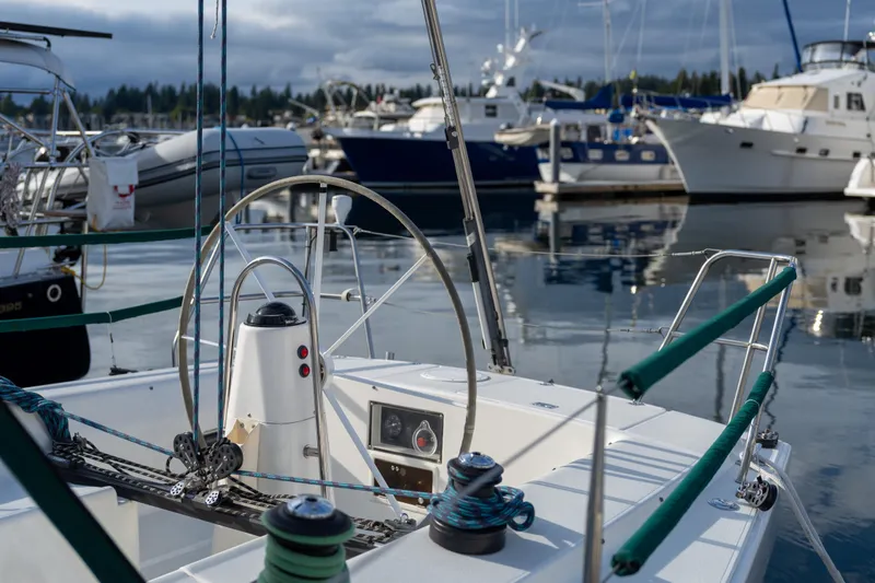 Slide: The Image of Cockpit of a 2000 J Boats J/120 sailboat docked in a marina. - 3