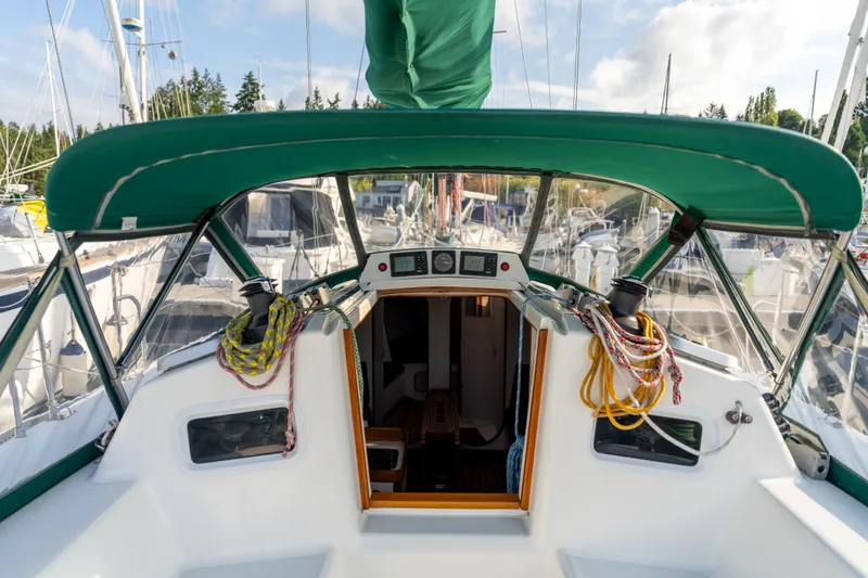Slide: The Image of Cockpit view of 2000 J Boats J/120 sailboat with green canopy and ropes. - 5