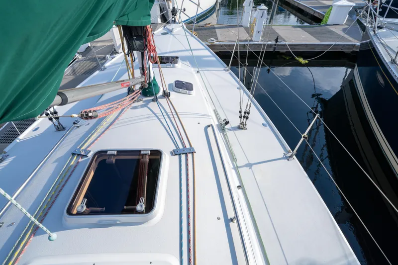 Slide: The Image of Deck view of 2000 J Boats J/120 sailboat docked at marina. - 7