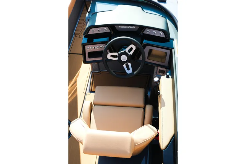 Slide: The Image of 2026 MasterCraft NXT24 boat cockpit with modern steering and dashboard controls. - 12
