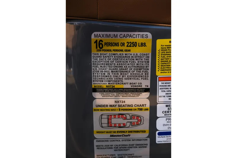 Slide: The Image of 2026 MasterCraft NXT24 capacity label: 16 persons or 2250 lbs, safety compliance details. - 20