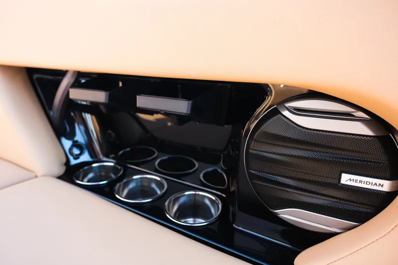 Slide: The Image of Interior of 2026 MasterCraft NXT24 boat with Meridian speaker and cup holders. - 21