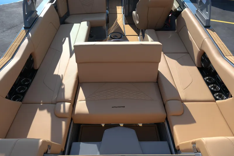 Slide: The Image of Luxurious interior of 2026 MasterCraft NXT24 boat with tan leather seating. - 23