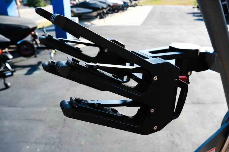 Slide: The Image of 2026 MasterCraft NXT24 boat accessory detail, featuring a sleek black wakeboard rack. - 24