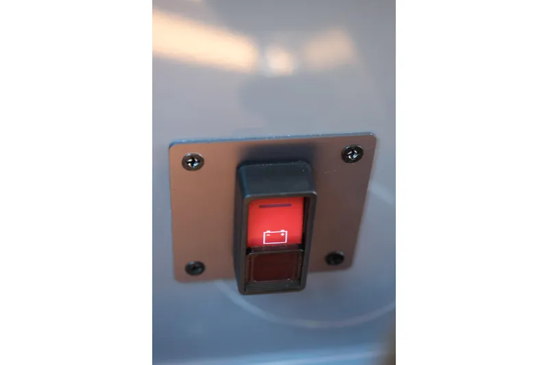 Slide: The Image of Red switch on 2026 MasterCraft NXT24 boat control panel. - 26