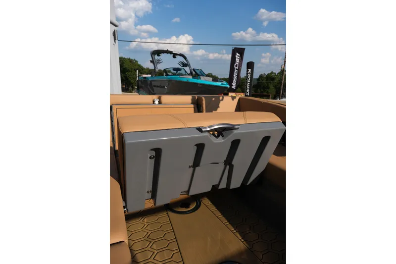 Slide: The Image of 2026 MasterCraft NXT24 boat interior with tan seating and sleek design. - 31