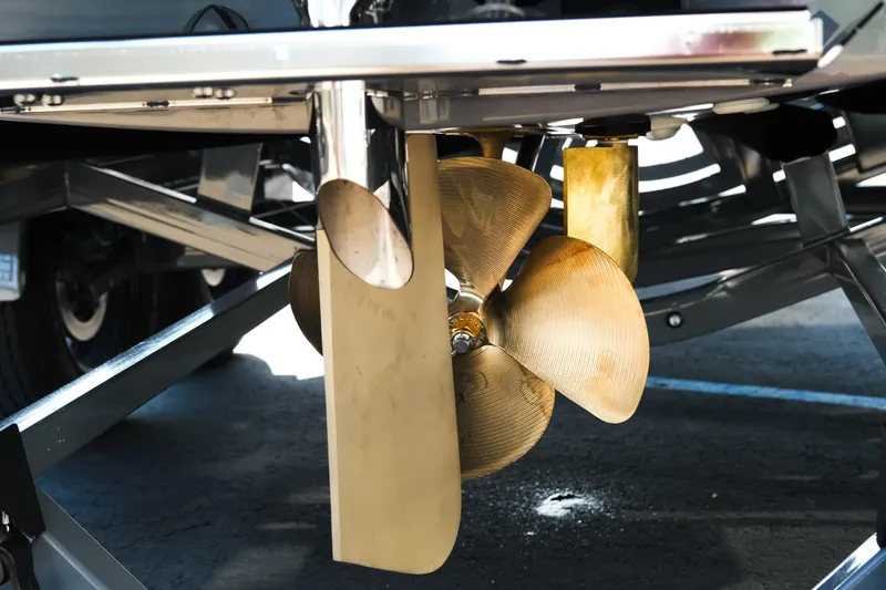 Slide: The Image of 2026 MasterCraft NXT24 boat propeller and rudder close-up. - 7