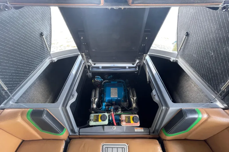 Slide: The Image of 2016 Nautique Super Air Nautique G23 Coastal Edition engine compartment with open hatches. - 6
