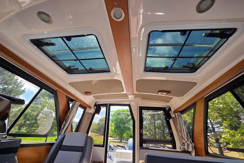 Slide: The Image of Interior view of 2026 Cutwater C-248 Coupe with panoramic windows and skylights. - 17