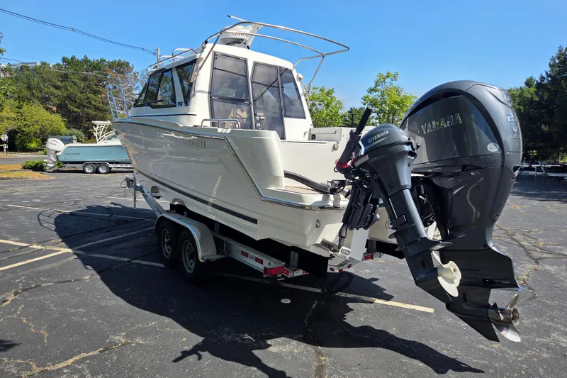 Slide: The Image of 2026 Cutwater C-248 Coupe boat on trailer with Yamaha outboard motor in parking lot. - 5
