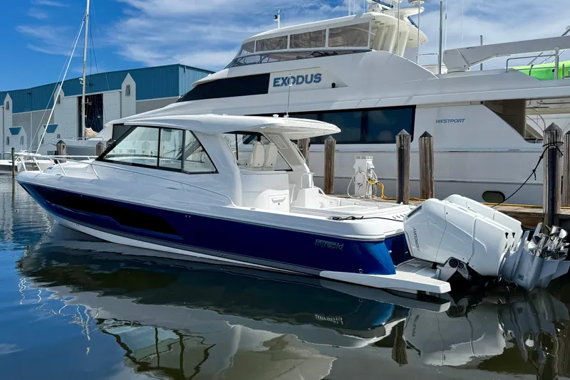 The Image of 2026 Intrepid 50 Evolution boat docked, featuring sleek design and powerful engines. - 0