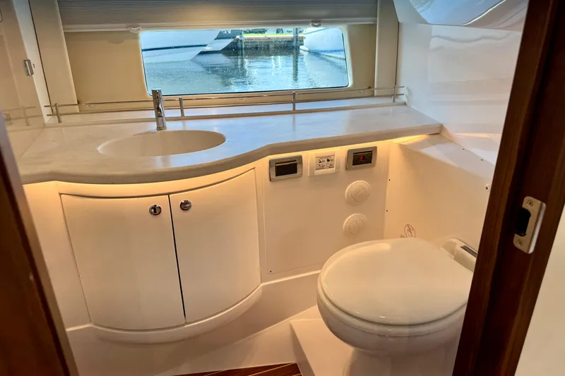 Slide: The Image of Luxurious bathroom interior of 2026 Intrepid 50 Evolution yacht with modern fixtures and window view. - 19