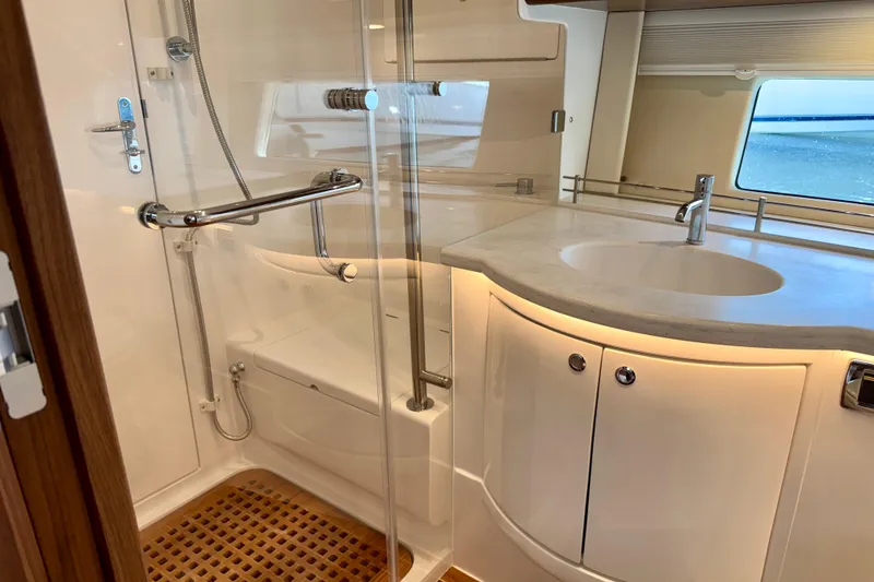 Slide: The Image of Luxurious bathroom in 2026 Intrepid 50 Evolution yacht with modern fixtures and elegant design. - 20