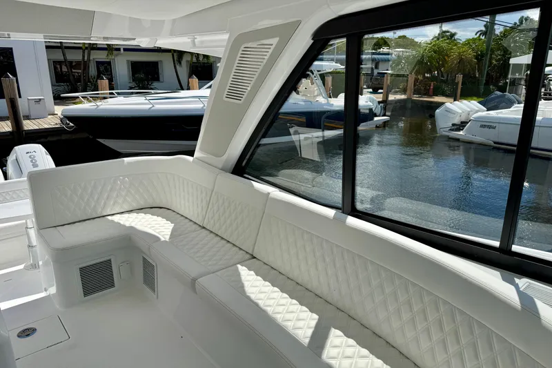 Slide: The Image of Luxurious interior of 2026 Intrepid 50 Evolution yacht with white quilted seating. - 21