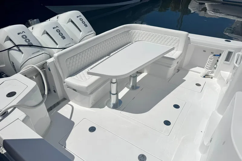 Slide: The Image of Luxury seating area on 2026 Intrepid 50 Evolution boat with triple Mercury engines. - 7