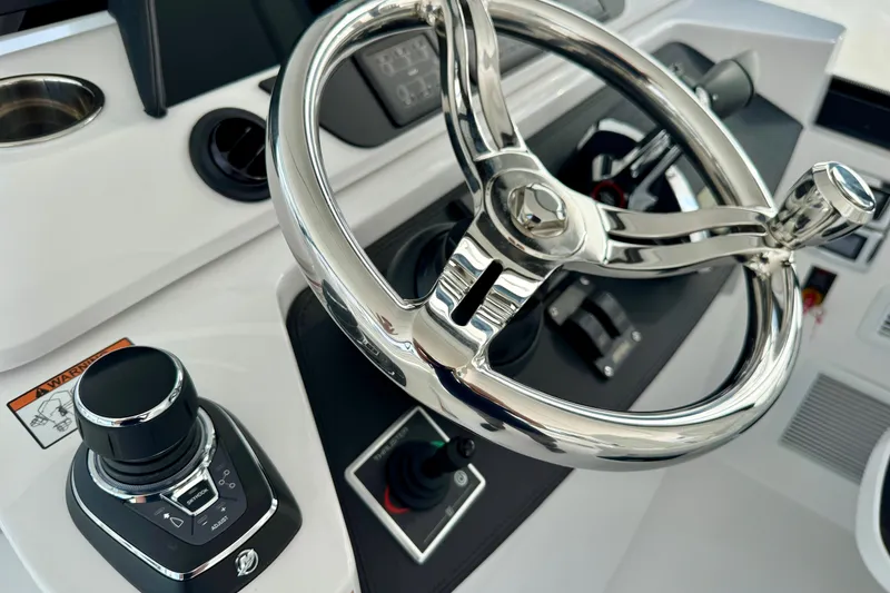 Slide: The Image of Steering wheel and controls of 2026 Intrepid 50 Evolution boat. - 8