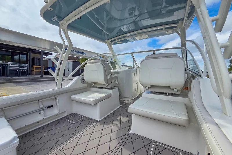 Slide: The Image of 2024 World Cat 296DC boat interior with white seating and modern design. - 13