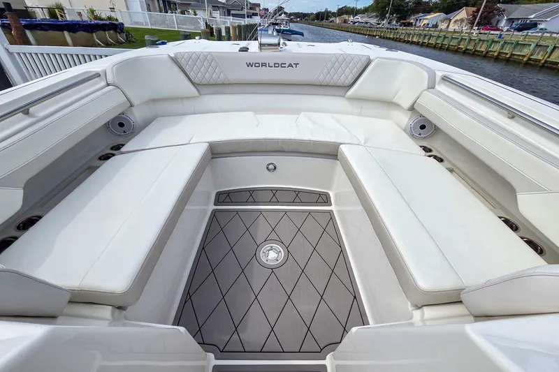 Slide: The Image of 2024 World Cat 296DC boat interior with steering console and seating. - 21