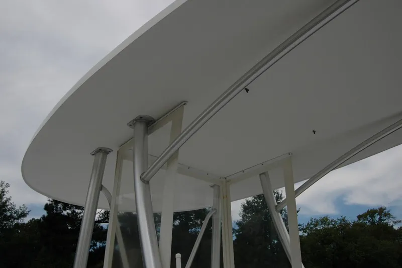 Slide: The Image of 2013 Composite Yacht 26 with sleek, modern design and sturdy metal supports. - 17