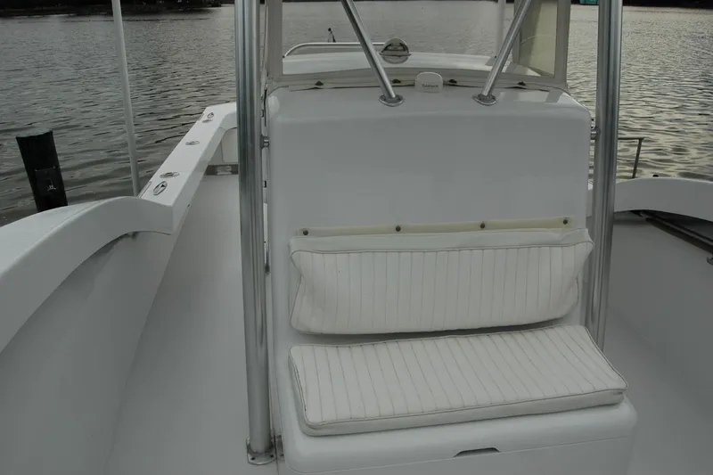 Slide: The Image of 2013 Composite Yacht 26 interior with white seating, sleek design, and water view. - 28