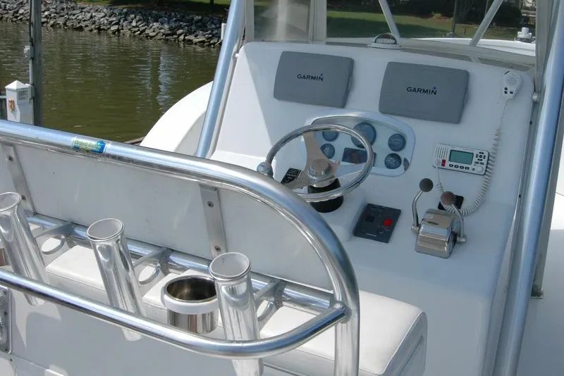 Slide: The Image of Control panel of a 2013 Composite Yacht 26 with Garmin navigation systems. - 40