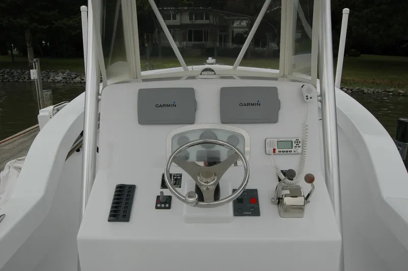 Slide: The Image of Steering console of 2013 Composite Yacht 26 with Garmin navigation equipment. - 41