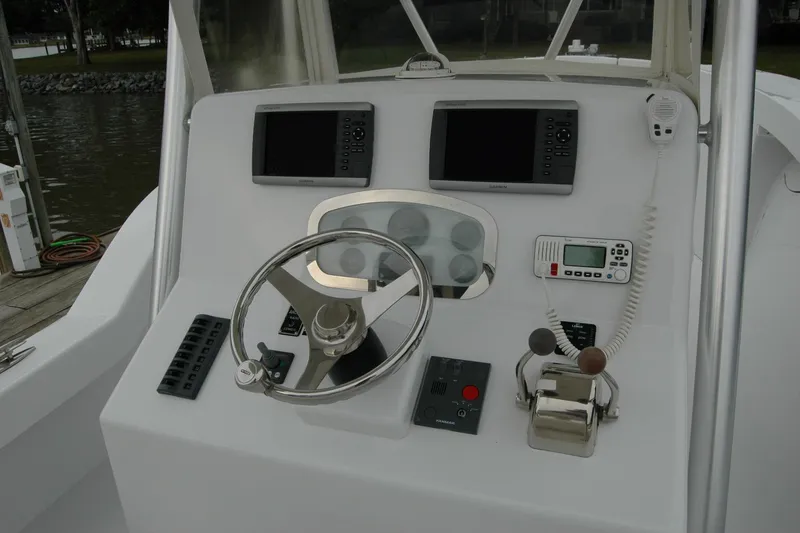 Slide: The Image of Helm of 2013 Composite Yacht 26 with steering wheel and navigation equipment. - 42