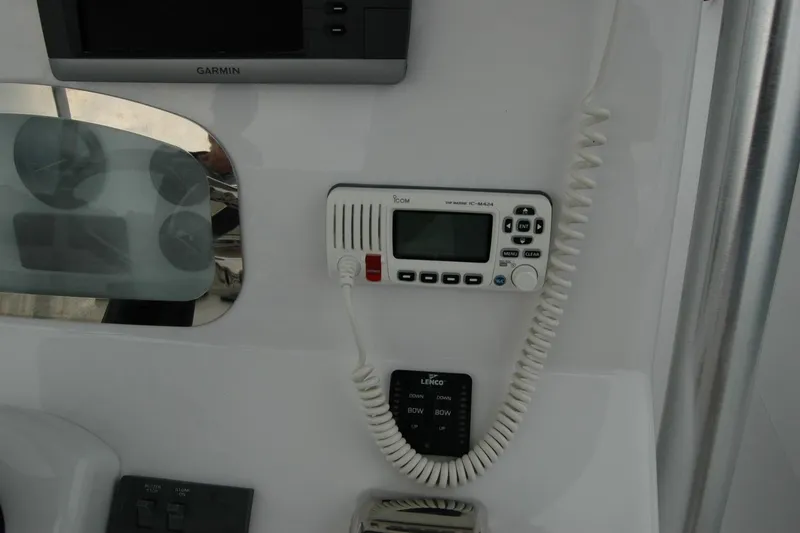 Slide: The Image of Control panel of a 2013 Composite Yacht 26 with Garmin and Icom devices. - 47