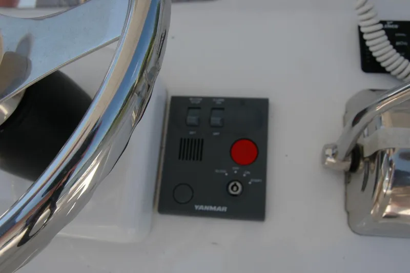 Slide: The Image of Steering wheel and control panel of 2013 Composite Yacht 26 with Yanmar system. - 50