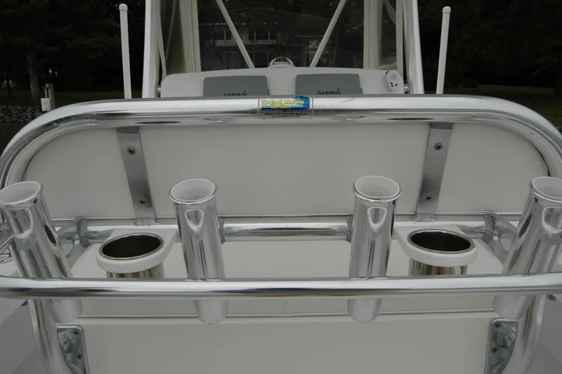Slide: The Image of Rod holders on a 2013 Composite Yacht 26, featuring a sleek metal finish. - 54
