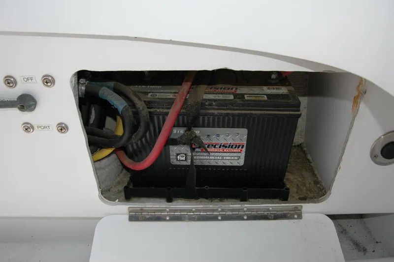Slide: The Image of Battery compartment of a 2013 Composite Yacht 26, featuring a Precision commercial battery. - 62