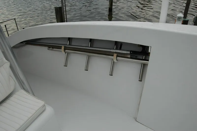 Slide: The Image of Interior view of a 2013 Composite Yacht 26, featuring rod holders and seating. - 65