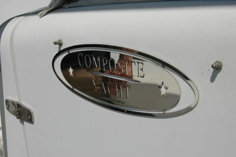 Slide: The Image of Composite Yacht 26 emblem on white surface, 2013 model. - 68