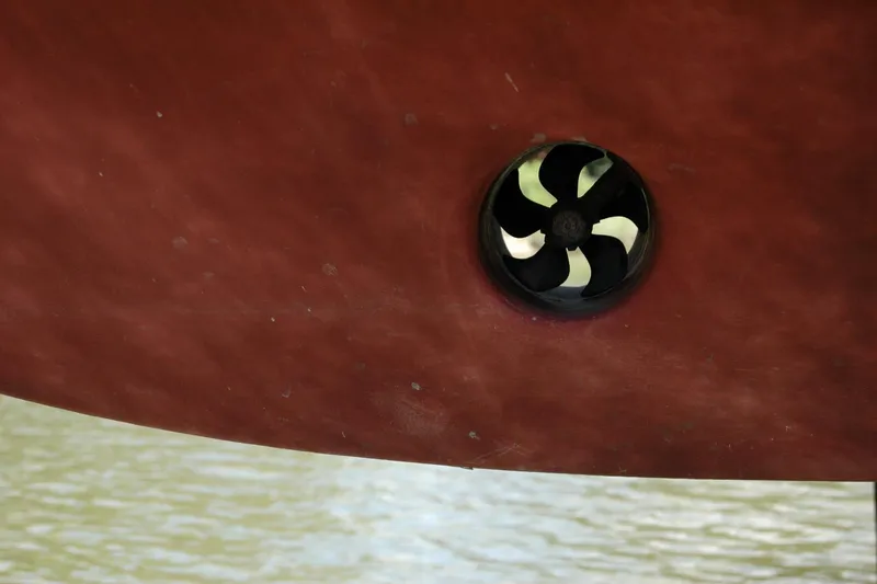 Slide: The Image of Close-up of a 2013 Composite Yacht 26 hull with a visible propeller. - 7