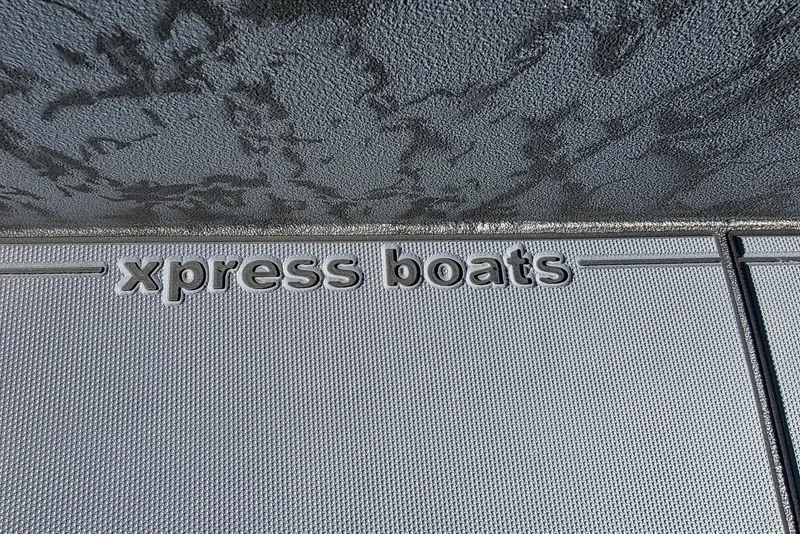 Slide: The Image of Xpress Boats logo on textured surface, 2026 Xpress X18DB model. - 16