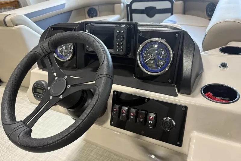 Slide: The Image of Steering console of 2026 Premier 220 Sunscape RF boat with gauges and controls. - 15