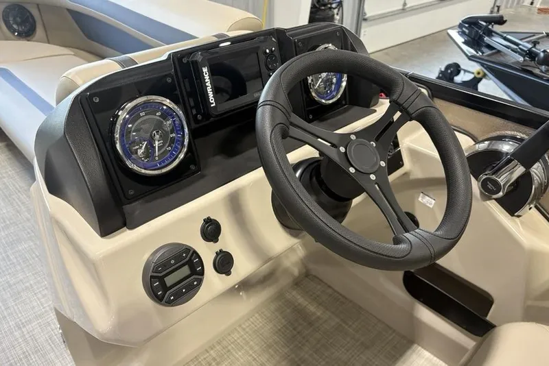 Slide: The Image of Steering console of 2026 Premier 220 Sunscape RF boat with modern controls and gauges. - 18