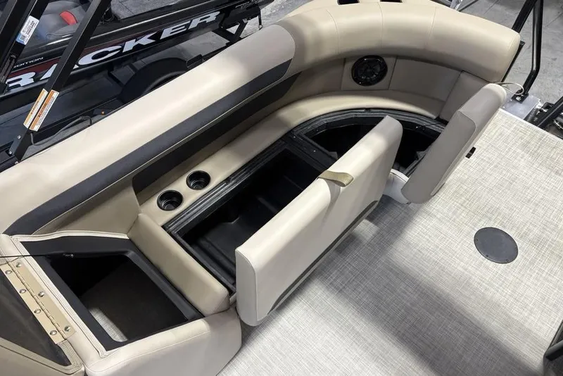 Slide: The Image of 2026 Premier 220 Sunscape RF boat interior with beige seating and storage compartments. - 20