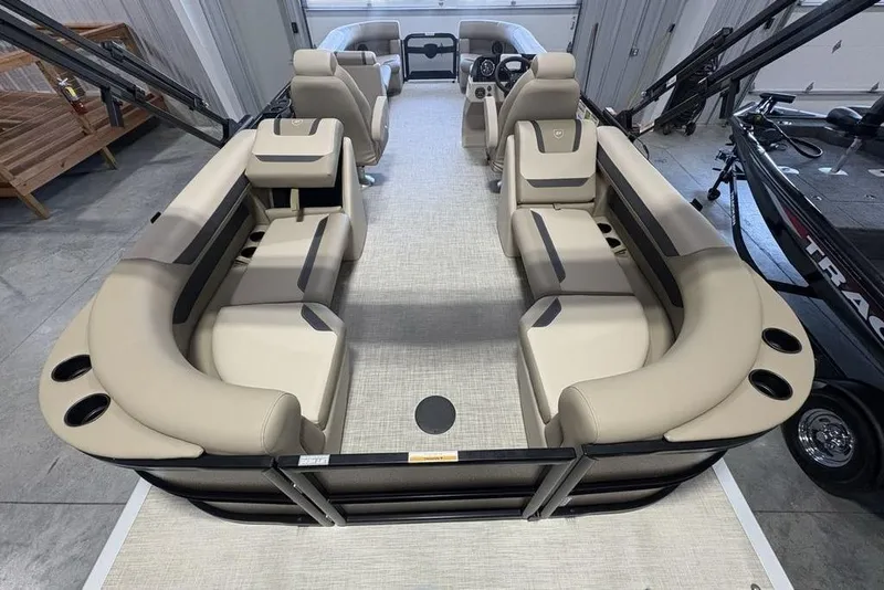 Slide: The Image of 2026 Premier 220 Sunscape RF pontoon boat interior with beige seating and modern design. - 31