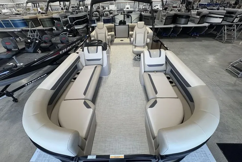 Slide: The Image of 2026 Premier 220 Sunscape RF pontoon boat with spacious seating in showroom. - 32