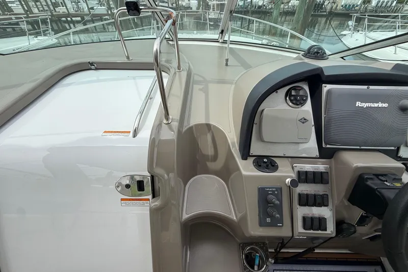 Slide: The Image of 2008 Cruisers Yachts 330 Express helm with Raymarine navigation system and control panel. - 26